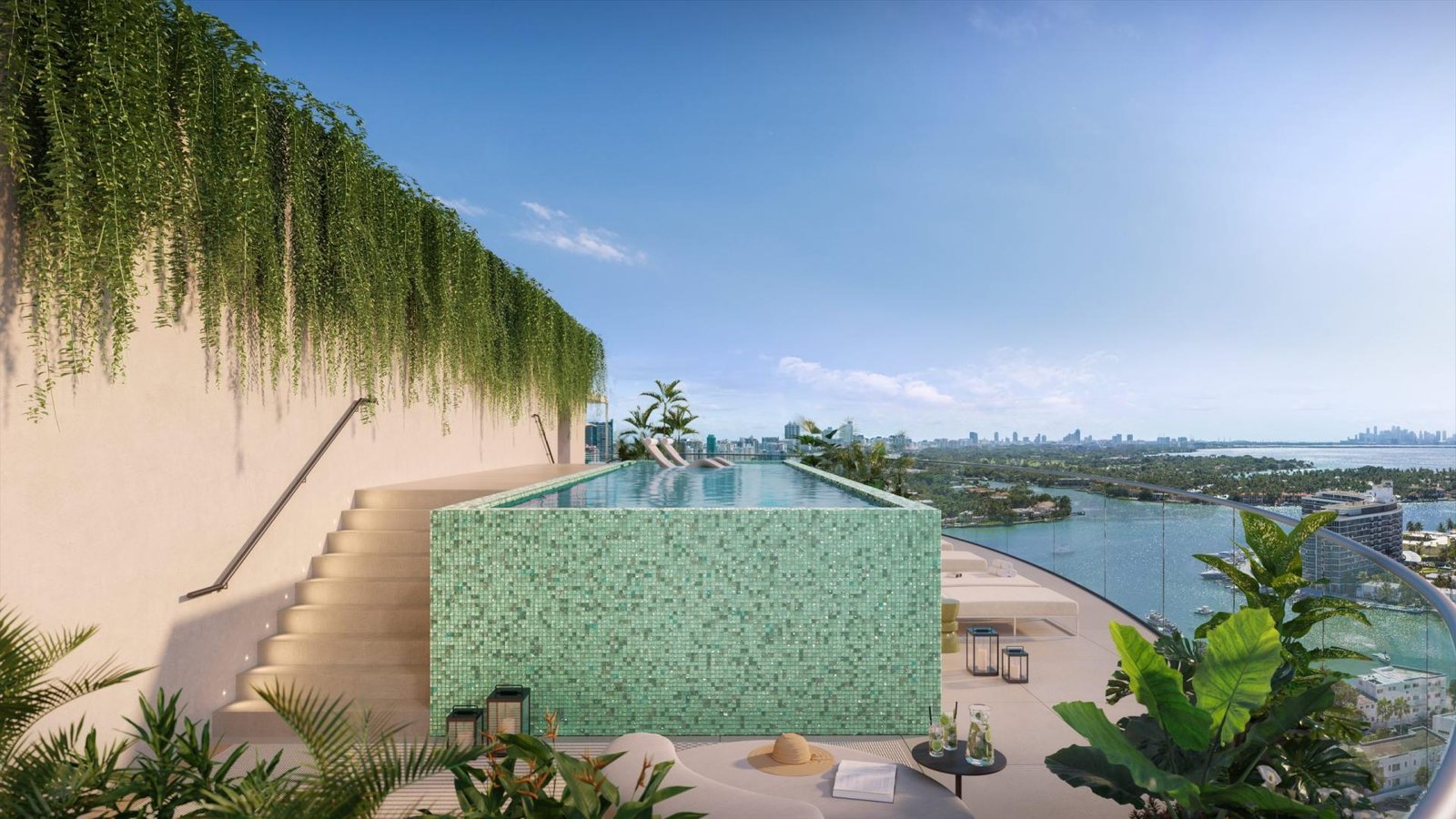 72 Carlyle Miami Beach resort pool terrace rendering with green mosaic tile, cabana loungers and Biscayne Bay beyond