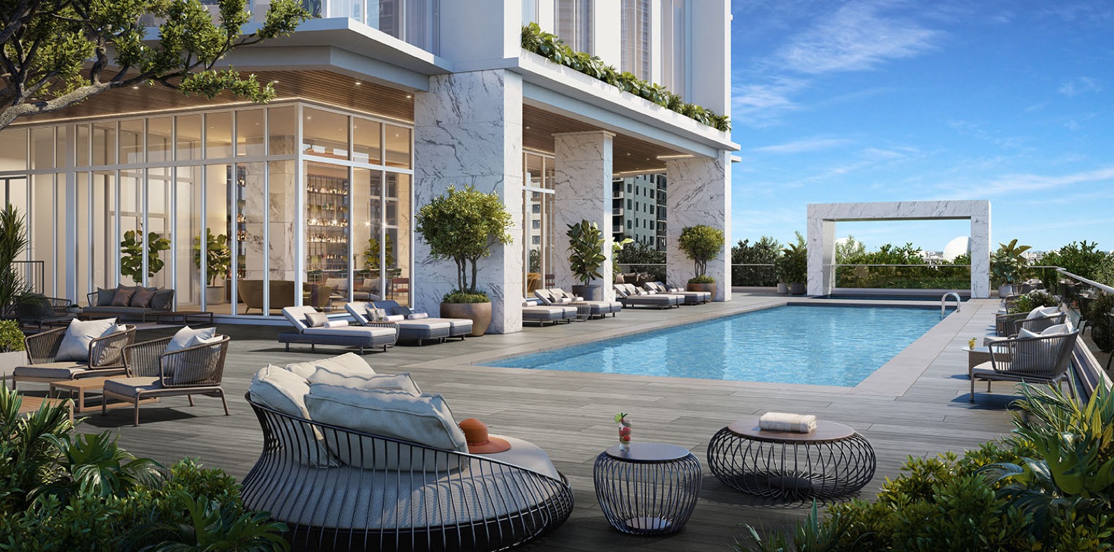 Okan Tower 12th floor amenity pool deck rendering with lounge seating and bay views, Downtown Miami