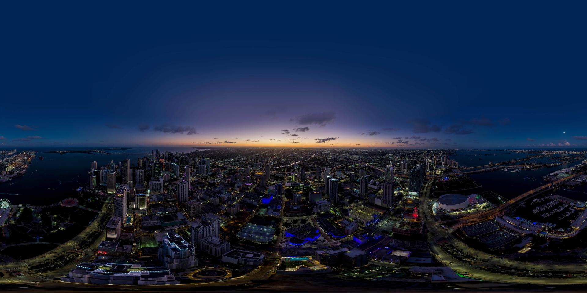 Panoramic twilight view from 1,049 feet at Waldorf Astoria Residences Miami showing the Miami skyline, Biscayne Bay, and the Atlantic Ocean