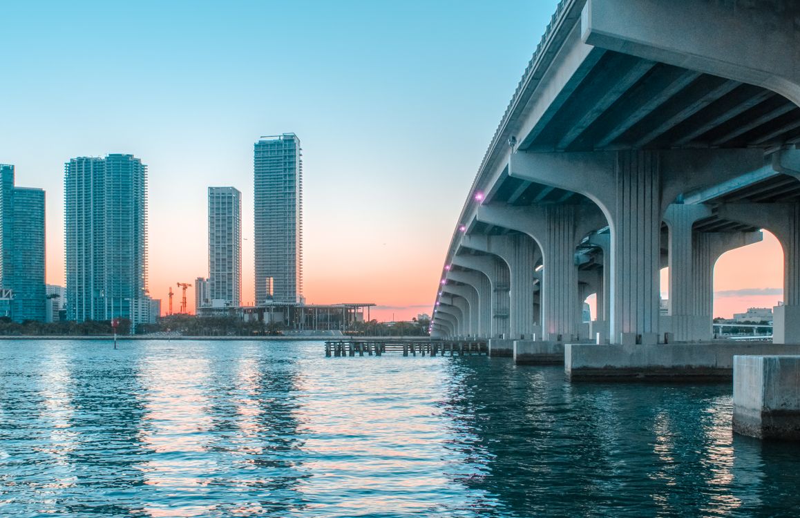Downtown Miami waterfront skyline and causeway across Biscayne Bay at sunset in 2026