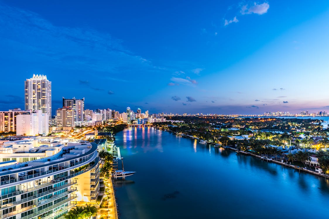Miami Beach waterfront skyline at dusk where New York luxury buyers are relocating in 2026