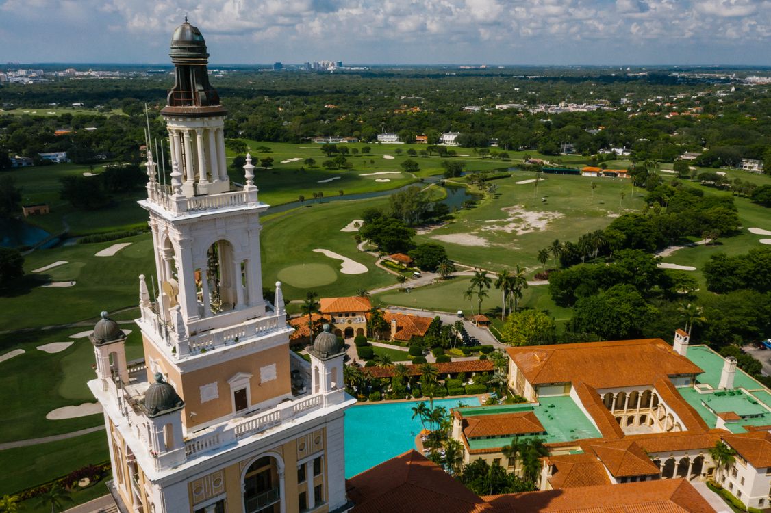 Aerial of the Coral Gables Biltmore tower and golf course, the supply-constrained submarket where Alhambra Parc secured a $100M construction loan in June 2026