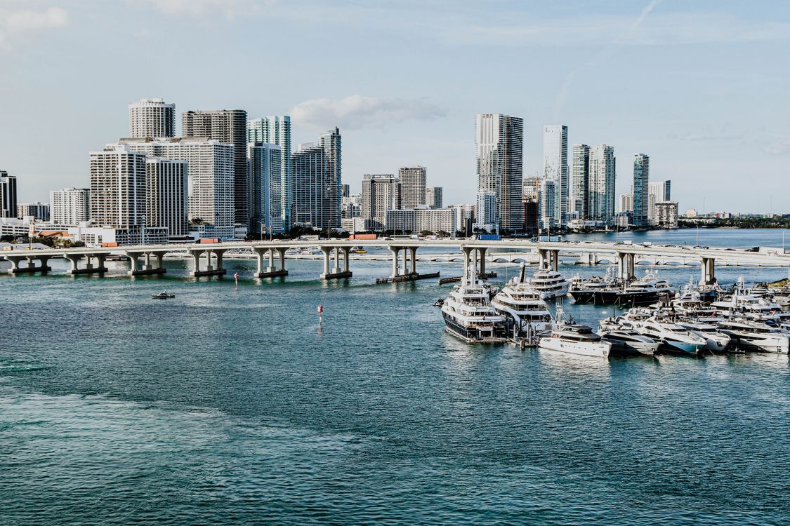 Miami downtown and Edgewater condo towers above a megayacht marina on Biscayne Bay 2026