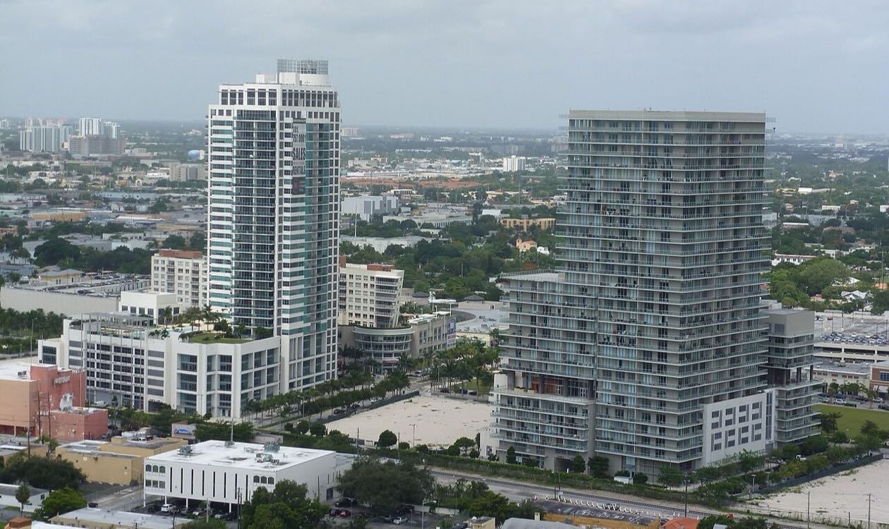 Midtown Miami condo towers rising above the low-rise Wynwood warehouse district in Miami