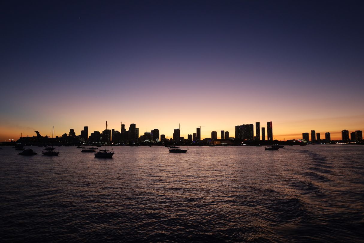 The Downtown Miami and Edgewater skyline at twilight seen across Biscayne Bay, the corridor where most of the 2028 delivery wave is rising
