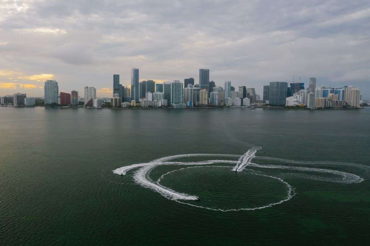 Brickell and Downtown Miami skyline with active construction cranes seen across Biscayne Bay, where 2021 and 2022 preconstruction contracts are closing in 2026
