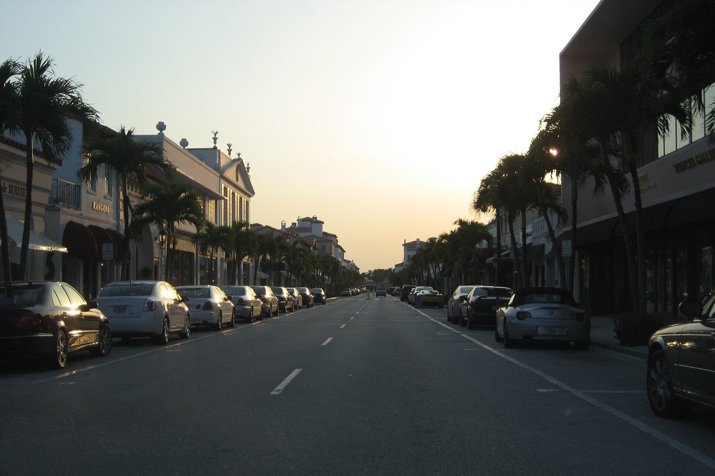 Shops and palm trees along Worth Avenue in the Town of Palm Beach, Florida