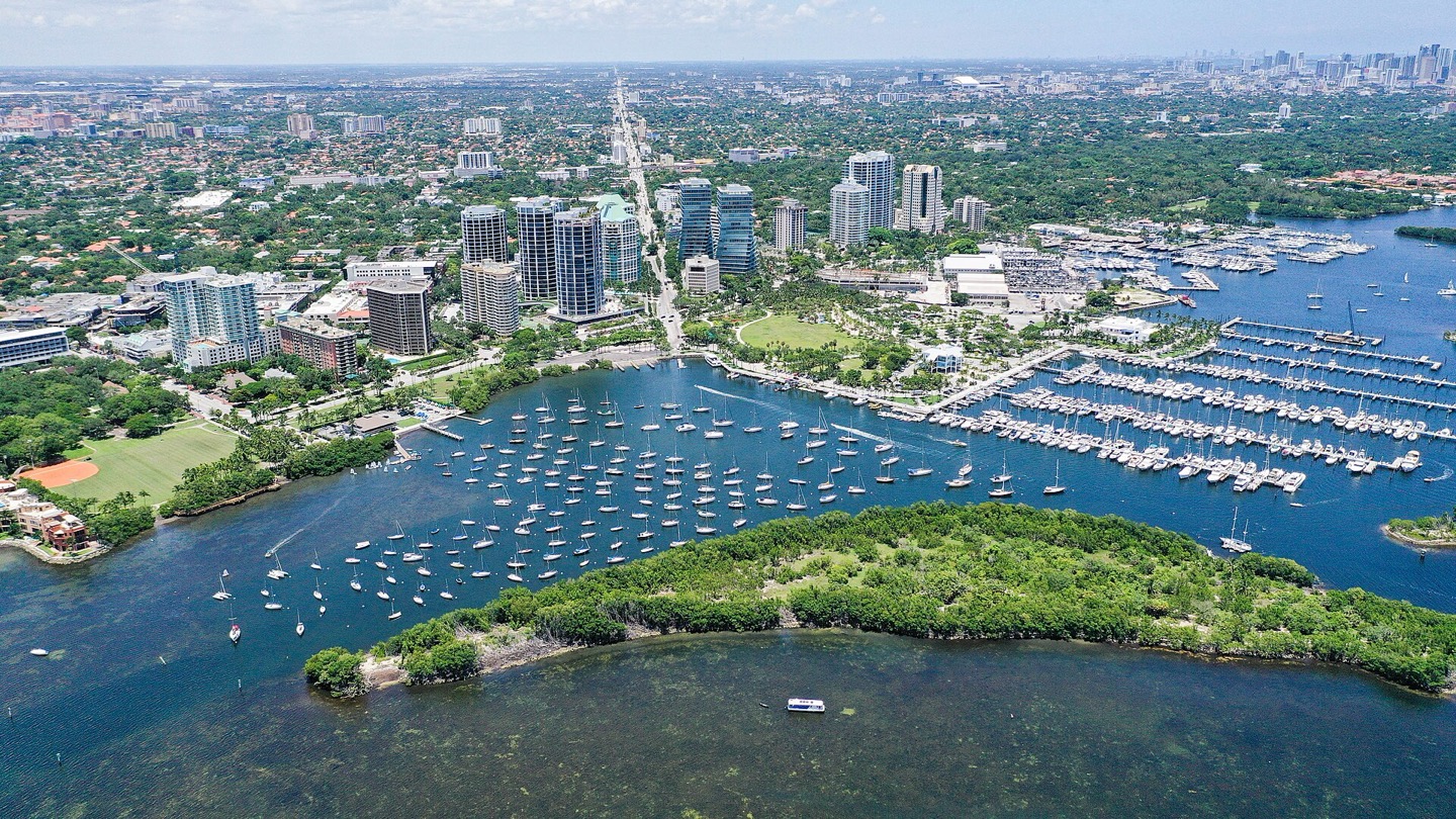 Aerial view of Coconut Grove, Dinner Key marina and the Grove condominium towers in Miami