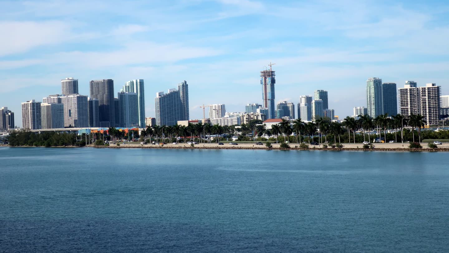 Miami high-rise under construction with a tower crane rising over the Edgewater skyline