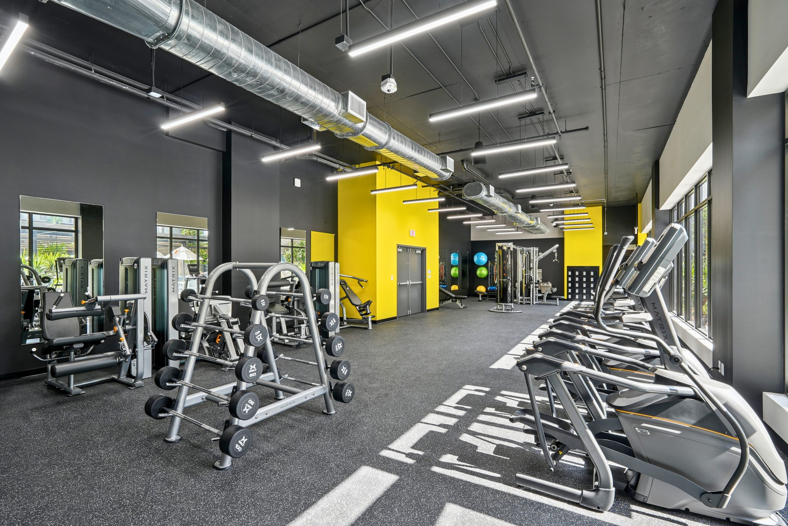 Metro Parc Hialeah fitness center rendering with cardio and strength equipment