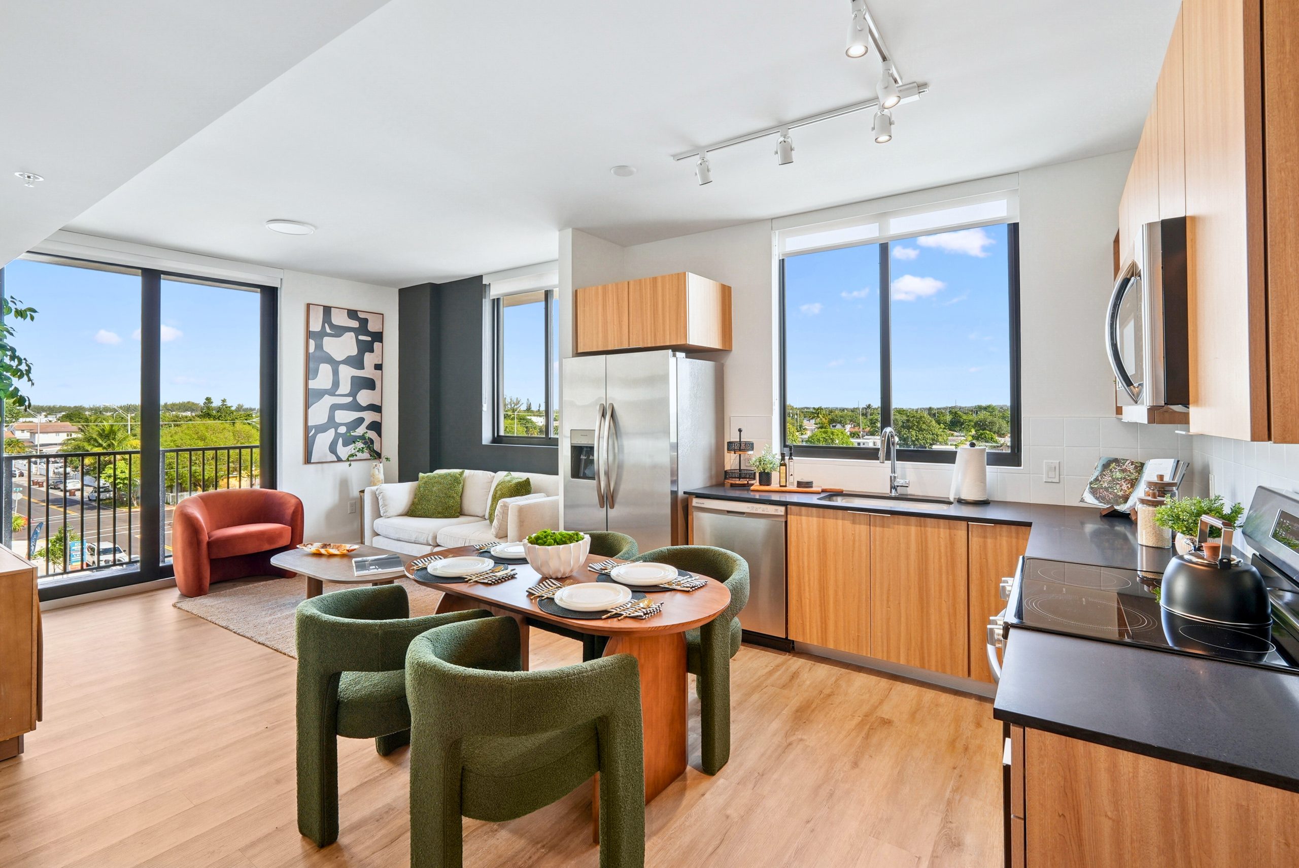 Metro Parc Hialeah residence rendering showing an open kitchen and living room