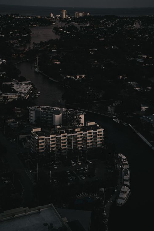 Aerial view of Fort Lauderdale at dusk showing the urban landscape and city lights